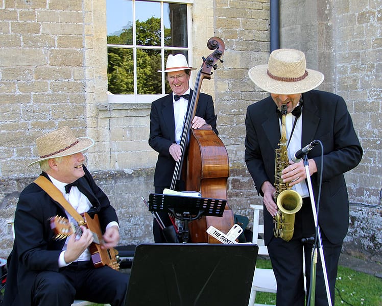 The Cocktail Trio - Sax, Guitar & Double Bass Image of a Jazz Trio playing at a wedding reception