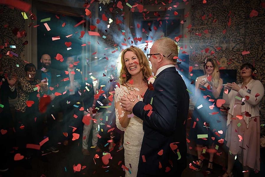 First-Dance-with-confetti bride and groom dancing with confetti cannon explosion