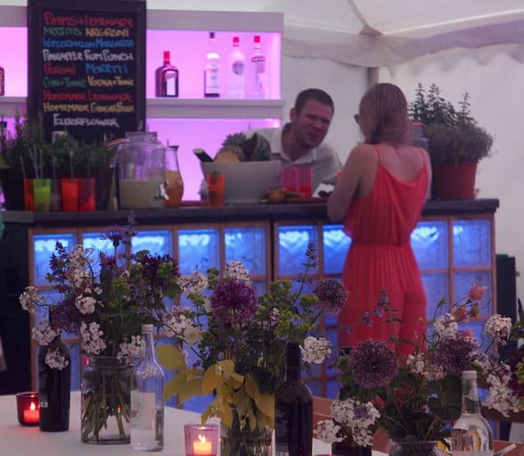 Image of a marquee party with a cocktail bar