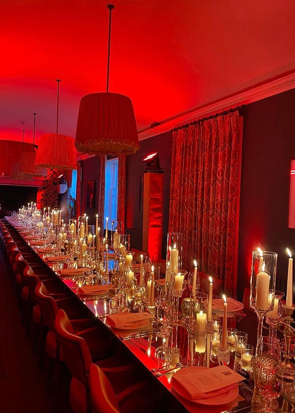 Red themed dinner party with a mirror table top