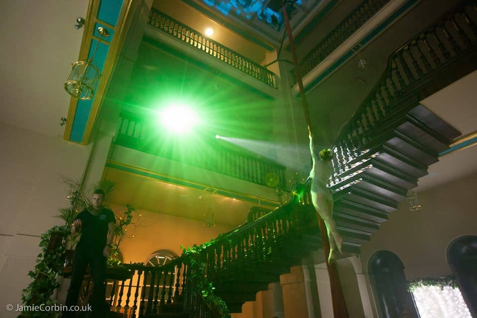 Trapeze Artist in atrium Image of a trapeze artist at a Spring Ball